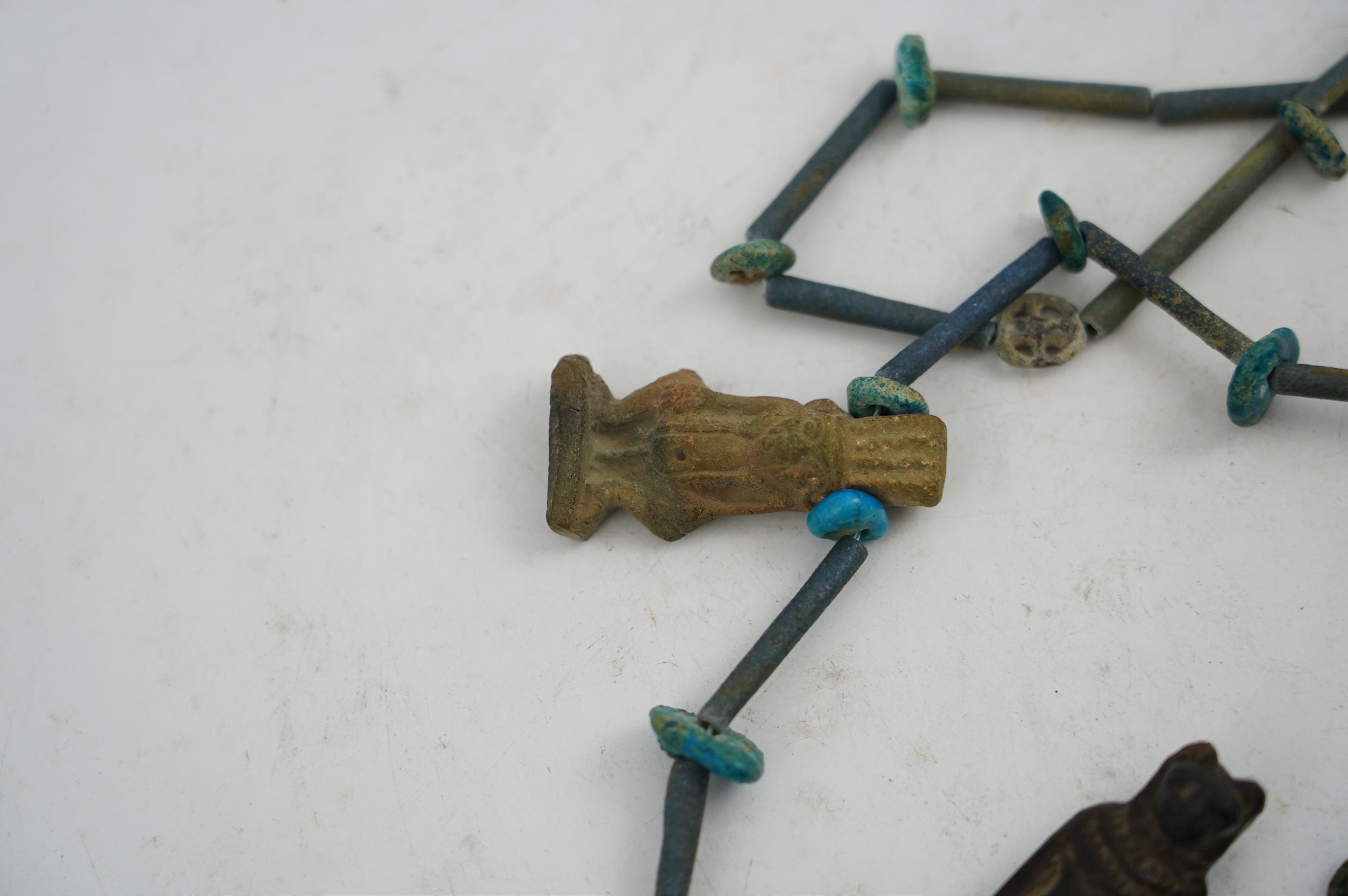 An ancient Egyptian faience necklace, amulets and scarabs, late Kingdom to Ptolemaic period